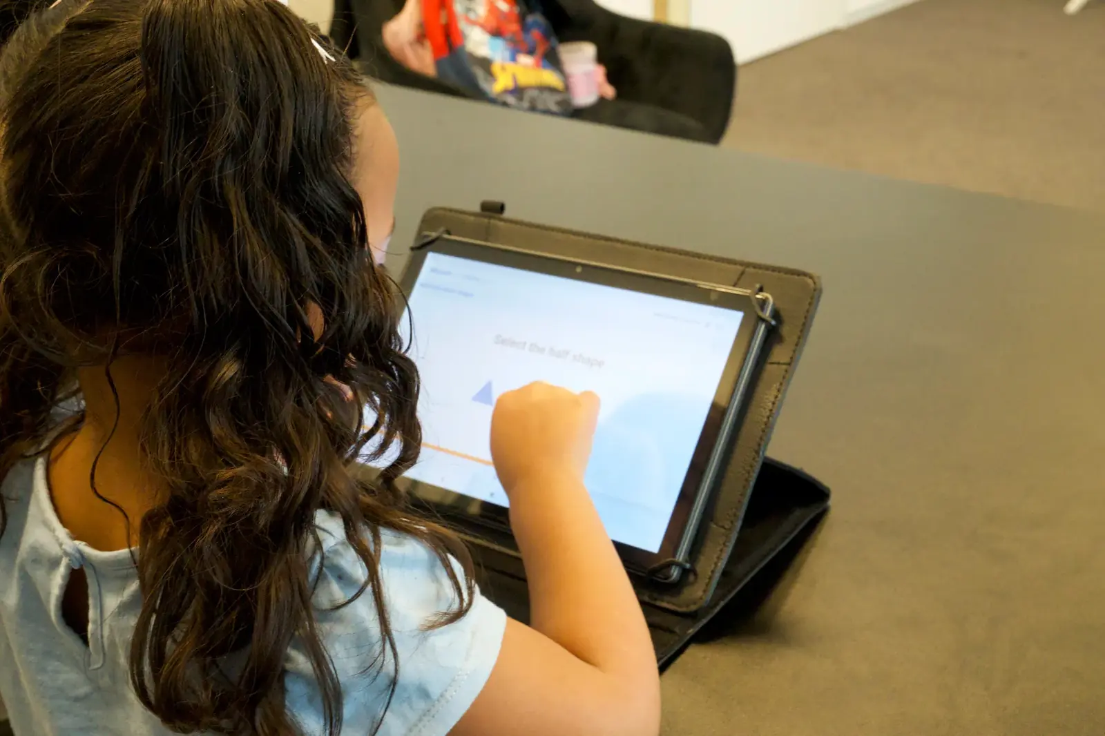 A student using WLearn independently on a tablet